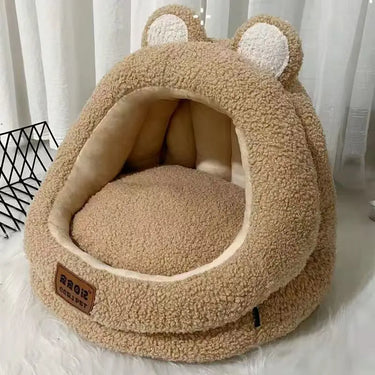 The Ultra Soft Cat Nest by KittyNook Cat Co. is a plush, beige bear-shaped bed with round ears for ultimate comfort.